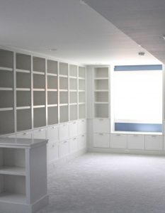 Dark, dank basement transformed into light and airy dream library